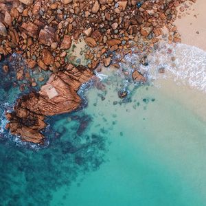 Preview wallpaper ocean, aerial view, water, stones, sand, foam