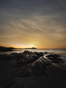 Preview wallpaper ocean, beach, rocks, sunset, dark