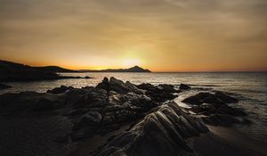 Preview wallpaper ocean, beach, rocks, sunset, dark