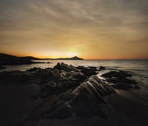 Preview wallpaper ocean, beach, rocks, sunset, dark