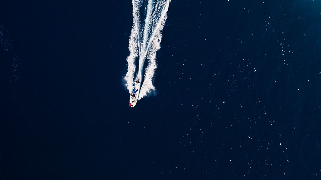 Wallpaper ocean, boat, trail, waves, aerial view