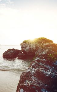 Preview wallpaper ocean, boats, rocks, shore, sunlight