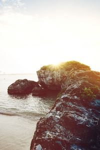 Preview wallpaper ocean, boats, rocks, shore, sunlight