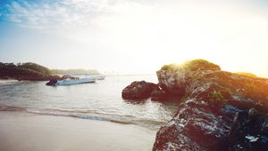 Preview wallpaper ocean, boats, rocks, shore, sunlight