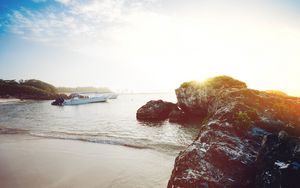 Preview wallpaper ocean, boats, rocks, shore, sunlight