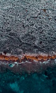 Preview wallpaper ocean, coast, aerial view, water, stones, surface, ribbed
