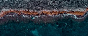 Preview wallpaper ocean, coast, aerial view, water, stones, surface, ribbed