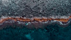 Preview wallpaper ocean, coast, aerial view, water, stones, surface, ribbed
