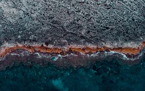 Preview wallpaper ocean, coast, aerial view, water, stones, surface, ribbed