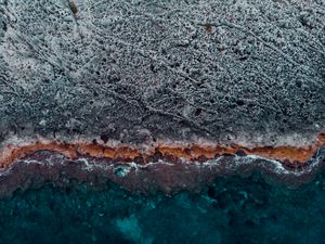 Preview wallpaper ocean, coast, aerial view, water, stones, surface, ribbed