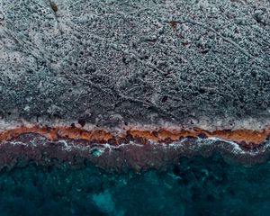 Preview wallpaper ocean, coast, aerial view, water, stones, surface, ribbed