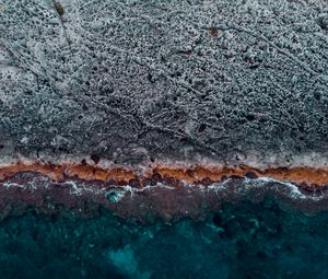 Preview wallpaper ocean, coast, aerial view, water, stones, surface, ribbed