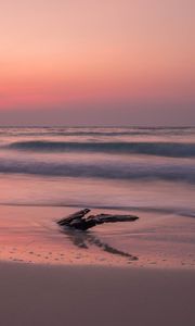 Preview wallpaper ocean, coast, sunset, cobble, sand, horizon