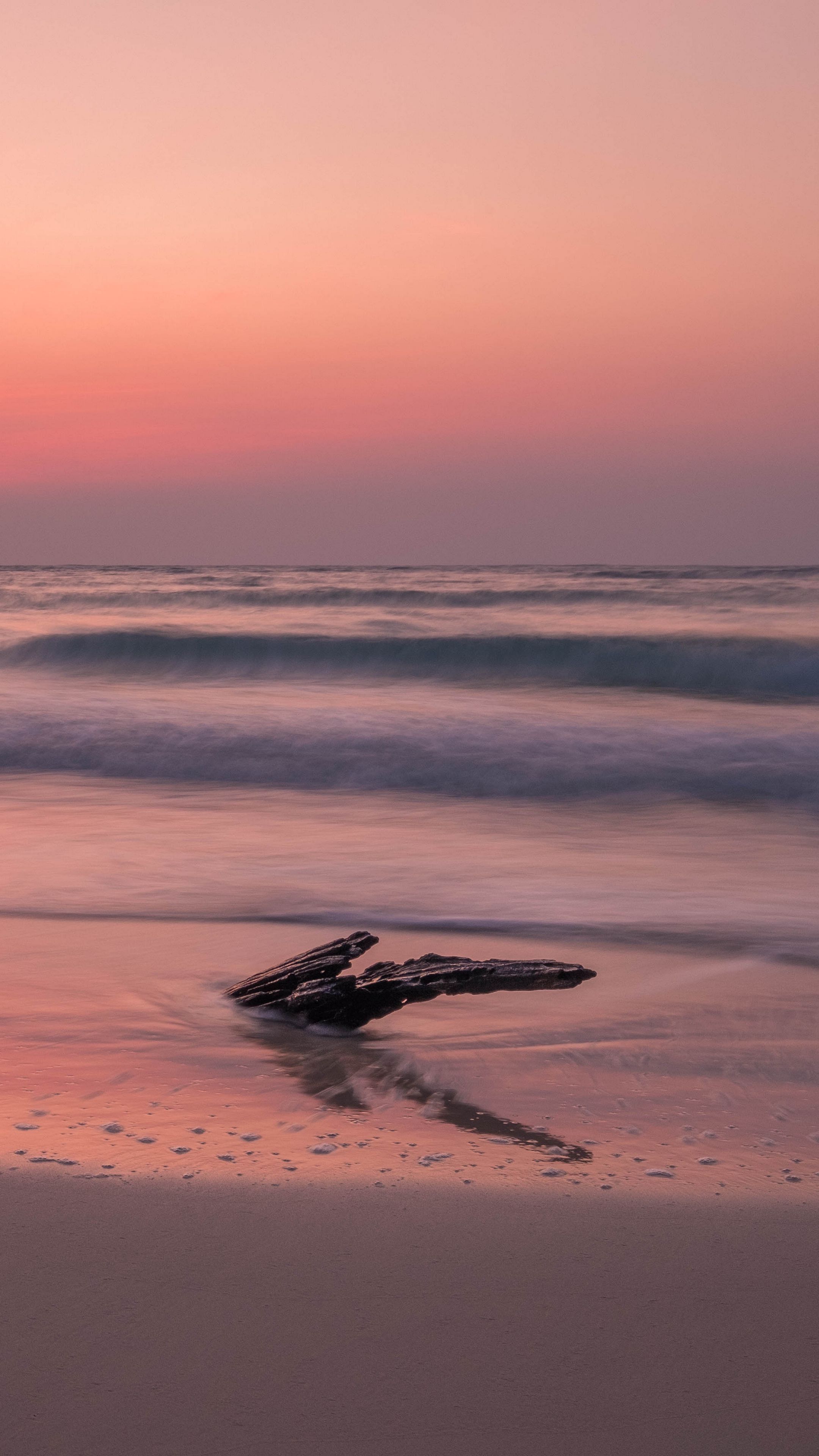 Download wallpaper 2160x3840 ocean, coast, sunset, cobble, sand