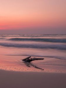 Preview wallpaper ocean, coast, sunset, cobble, sand, horizon