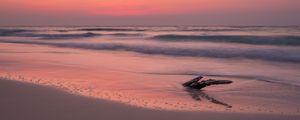 Preview wallpaper ocean, coast, sunset, cobble, sand, horizon