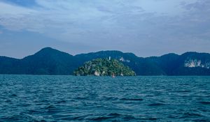 Preview wallpaper ocean, island, rocks, horizon, waves, ripples