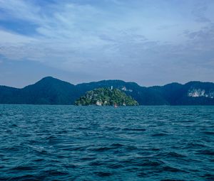 Preview wallpaper ocean, island, rocks, horizon, waves, ripples