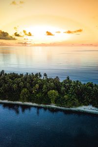 Preview wallpaper ocean, island, sunset, aerial view, summer, tropics