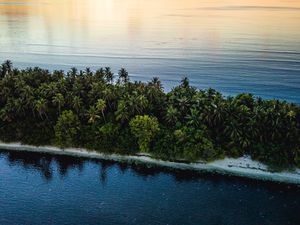 Preview wallpaper ocean, island, sunset, aerial view, summer, tropics