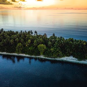 Preview wallpaper ocean, island, sunset, aerial view, summer, tropics