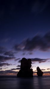 Preview wallpaper ocean, rocks, clouds, dark, twilight