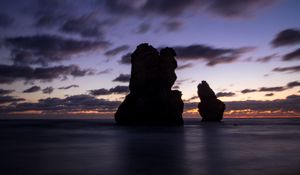 Preview wallpaper ocean, rocks, clouds, dark, twilight