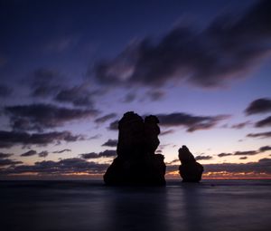 Preview wallpaper ocean, rocks, clouds, dark, twilight