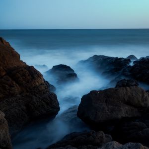 Preview wallpaper ocean, rocks, stones, fog, horizon