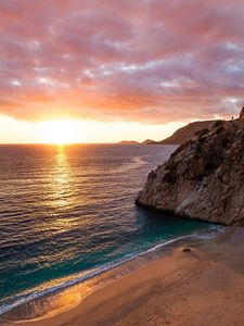 Preview wallpaper ocean, rocks, sunset, coast, sea