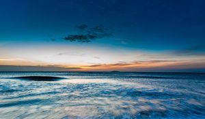 Preview wallpaper ocean, sea, horizon, sunset, shore, surf, sky