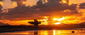 Preview wallpaper ocean, silhouettes, surfing, surfers, sunset