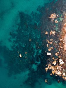 Preview wallpaper ocean, stones, aerial view, water, ripples, bottom