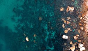 Preview wallpaper ocean, stones, aerial view, water, ripples, bottom