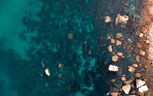 Preview wallpaper ocean, stones, aerial view, water, ripples, bottom