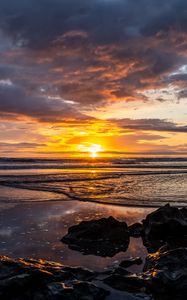 Preview wallpaper ocean, stones, horizon, sunset, dark