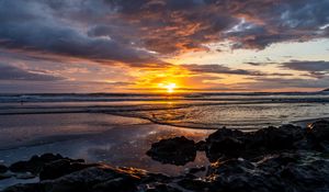 Preview wallpaper ocean, stones, horizon, sunset, dark