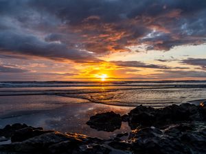 Preview wallpaper ocean, stones, horizon, sunset, dark