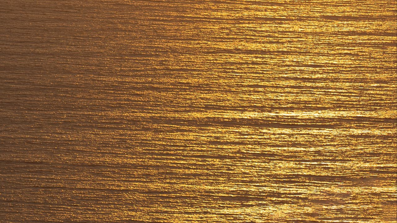 Wallpaper ocean, sunset, aerial view, ripples, waves, water