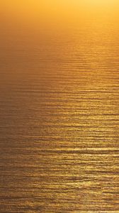 Preview wallpaper ocean, sunset, aerial view, ripples, waves, water