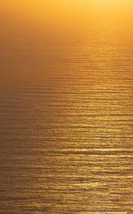 Preview wallpaper ocean, sunset, aerial view, ripples, waves, water