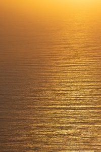 Preview wallpaper ocean, sunset, aerial view, ripples, waves, water