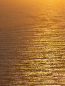 Preview wallpaper ocean, sunset, aerial view, ripples, waves, water