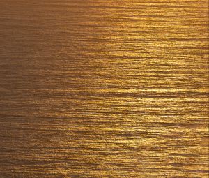 Preview wallpaper ocean, sunset, aerial view, ripples, waves, water