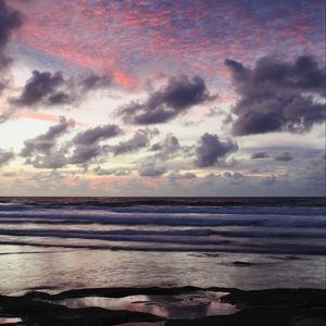 Preview wallpaper ocean, sunset, coast, clouds, shore, beautiful landscape