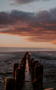 Preview wallpaper ocean, sunset, horizon, pier