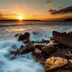 Preview wallpaper ocean, surf, waves, stones, sunset