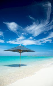 Preview wallpaper ocean, umbrella, horizon, clouds, tropics, shore