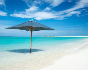 Preview wallpaper ocean, umbrella, horizon, clouds, tropics, shore