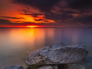 Preview wallpaper ocean, water, stones, horizon, sunset